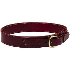 The Deluxe Holster Belt 2 1/4″ in brown leather, featuring a gold buckle, is coiled into a circular shape.