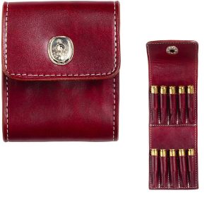 The Deluxe Rifle Cartridge Carrier in red leather, closed on the left and open on the right, showcases slots holding six brass-tipped cartridges.