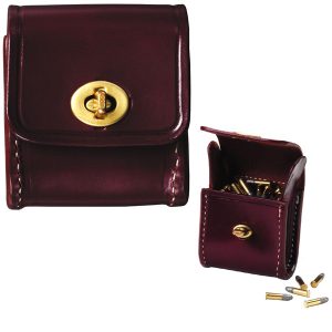The Cartridge Carrier .22LR is a maroon leather pouch with a brass clasp, shown open and closed, designed to hold several small bullets.